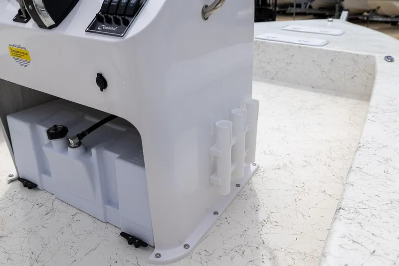 Slide: The Image of 2026 Coastal Skiff 231 boat console with rod holders and storage compartment. - 20