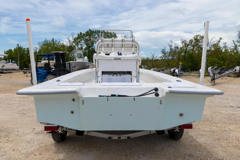 Slide: The Image of 2026 Coastal Skiff 231 boat on trailer, rear view, outdoors. - 3