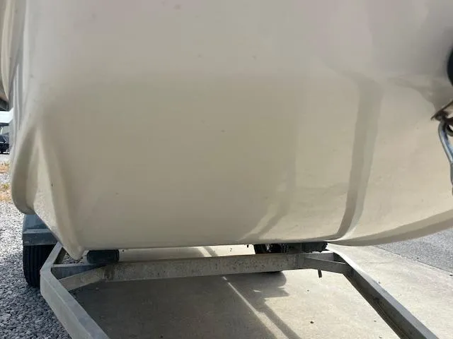 Slide: The Image of 2000 Carolina Skiff J1450 boat hull on trailer, close-up view. - 5