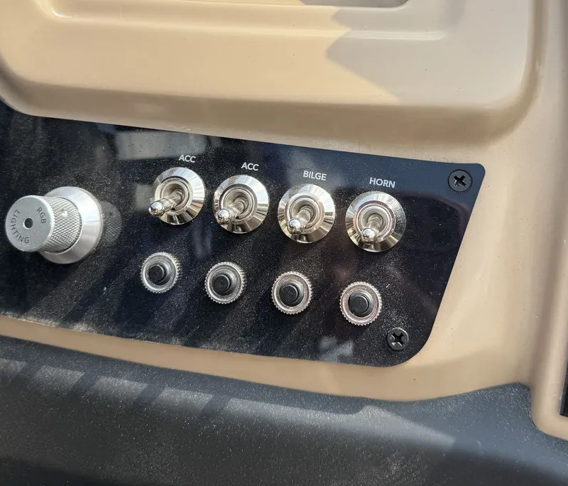 Slide: The Image of Close-up of a boat control panel with toggle switches for accessories, bilge, and horn. - 13