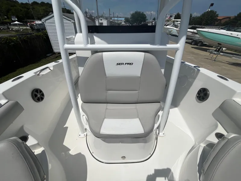 Slide: The Image of 2018 Sea Pro 219 Center Console boat interior with seating and console view. - 10
