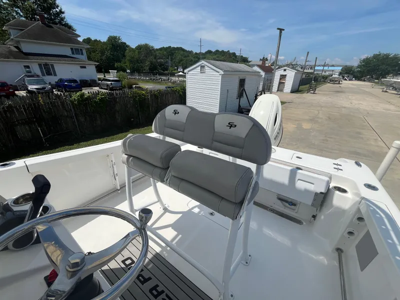 Slide: The Image of 2018 Sea Pro 219 Center Console boat with dual seats and steering wheel. - 11