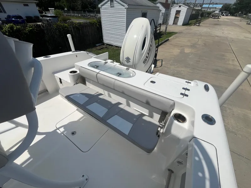 Slide: The Image of 2018 Sea Pro 219 Center Console boat with seating and Suzuki outboard motor. - 13