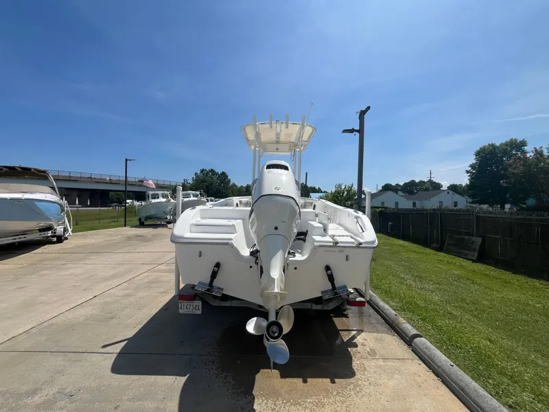 Slide: The Image of 2018 Sea Pro 219 Center Console boat parked on a sunny day. - 3