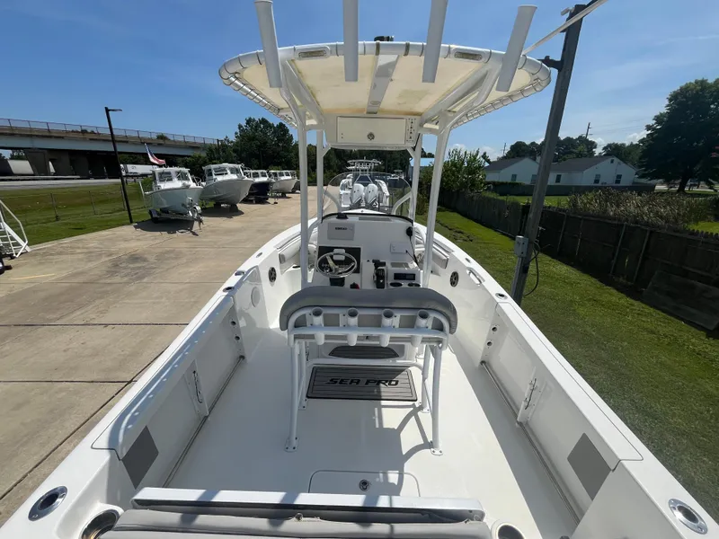 Slide: The Image of 2018 Sea Pro 219 Center Console boat with T-top, docked outdoors. - 4
