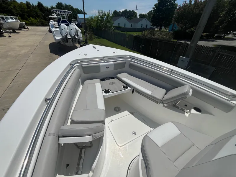 Slide: The Image of 2018 Sea Pro 219 Center Console boat with spacious seating and cup holders. - 7