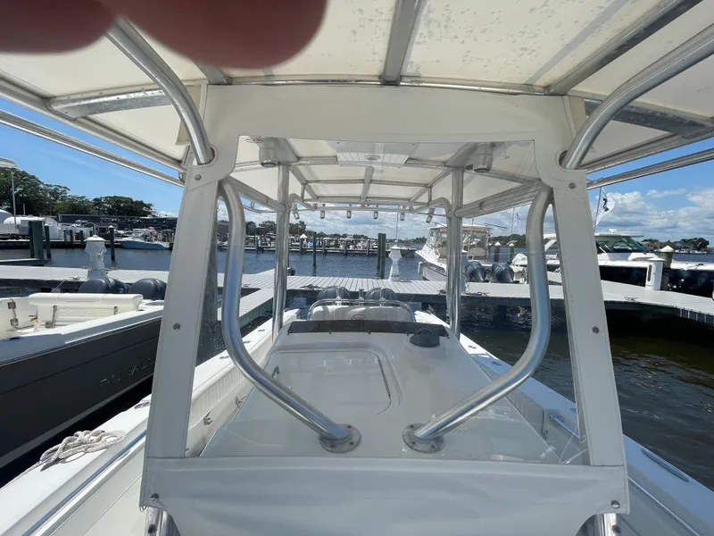 Slide: The Image of 2006 Southport 26 Center Console boat docked at marina under clear sky. - 12