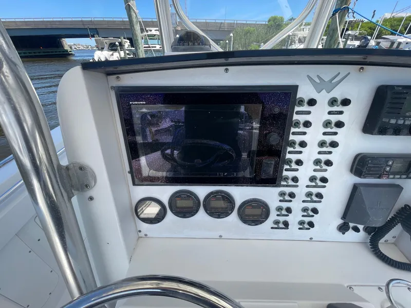 Slide: The Image of 2006 Southport 26 Center Console dashboard with navigation and control panel. - 20