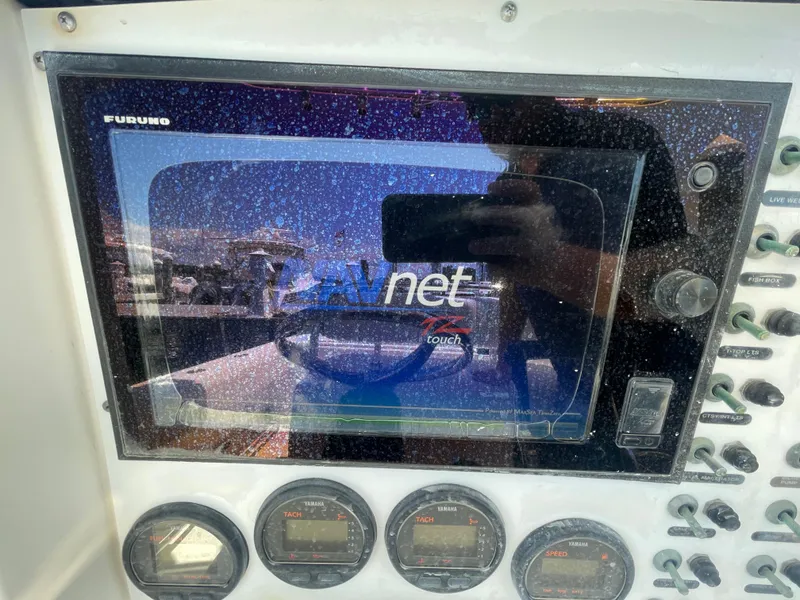 Slide: The Image of Control panel of a 2006 Southport 26 Center Console boat with Furuno NavNet display. - 22