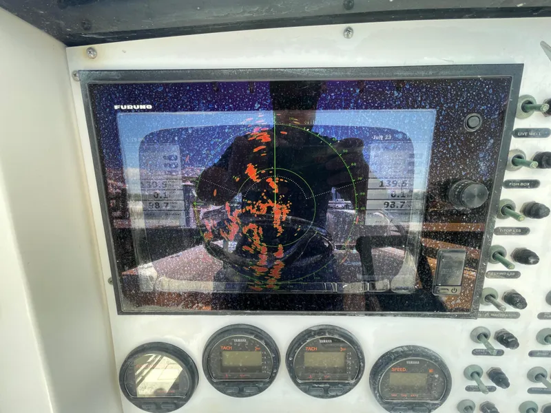 Slide: The Image of Close-up of a 2006 Southport 26 Center Console boat's radar and control panel. - 23