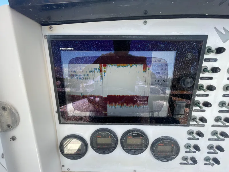 Slide: The Image of Boat dashboard with Furuno display and Yamaha gauges on a 2006 Southport 26 Center Console. - 26