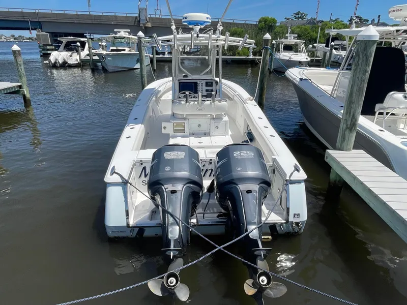 Slide: The Image of 2006 Southport 26 Center Console boat docked with twin 225 engines. - 3