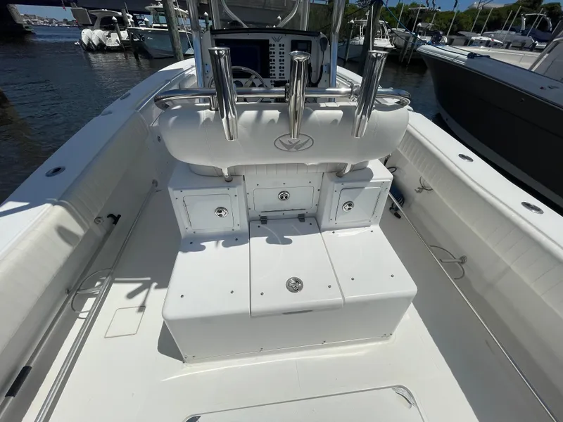 Slide: The Image of 2006 Southport 26 Center Console boat interior with rod holders and storage compartments. - 31