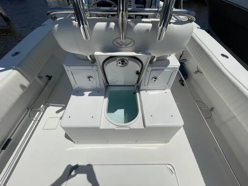 Slide: The Image of 2006 Southport 26 Center Console boat interior with seating and storage compartments. - 32