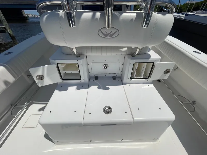 Slide: The Image of 2006 Southport 26 Center Console boat interior with storage compartments and seating. - 33