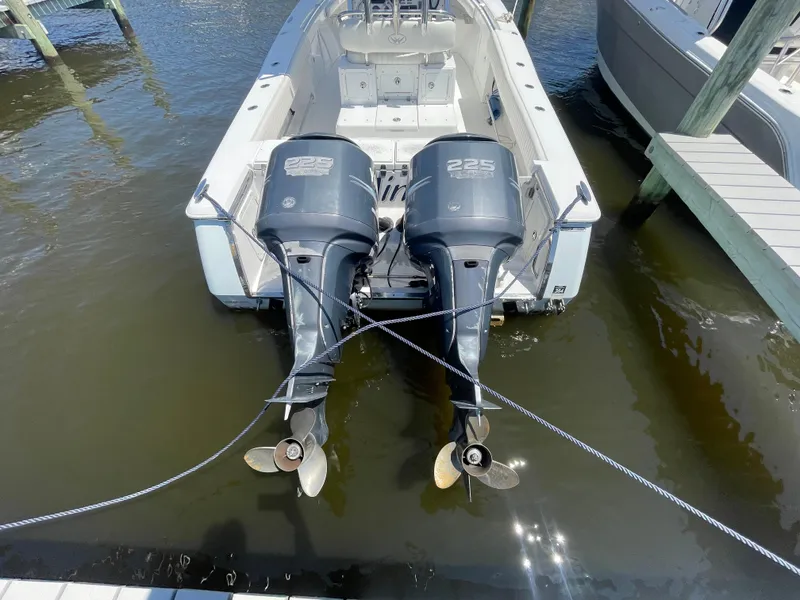 Slide: The Image of 2006 Southport 26 Center Console boat with twin 225 horsepower engines docked. - 38