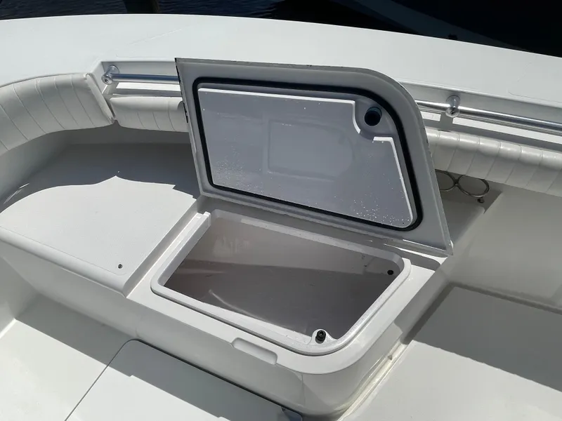 Slide: The Image of Open storage compartment on a 2006 Southport 26 Center Console boat. - 8