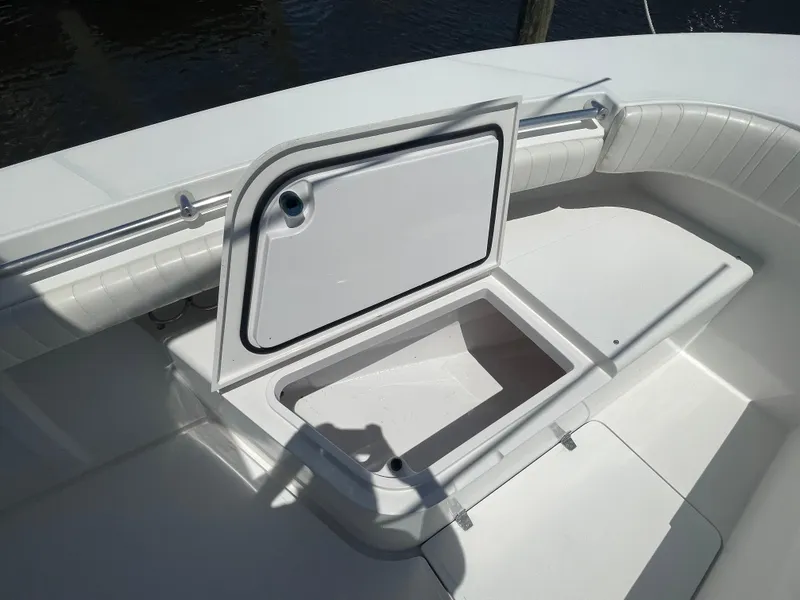 Slide: The Image of Open storage compartment on a 2006 Southport 26 Center Console boat. - 9