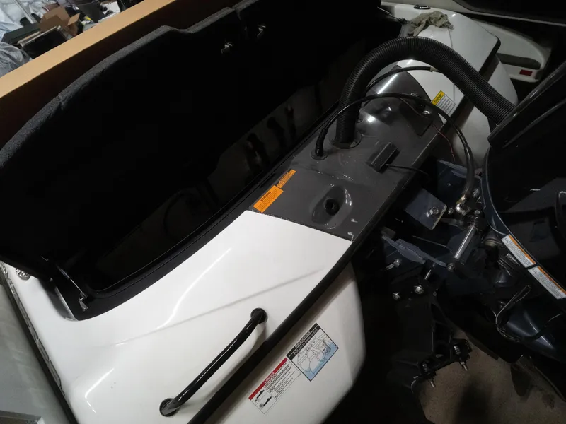 Slide: The Image of 2025 Skeeter ZXR20 boat interior showing engine compartment and components. - 4
