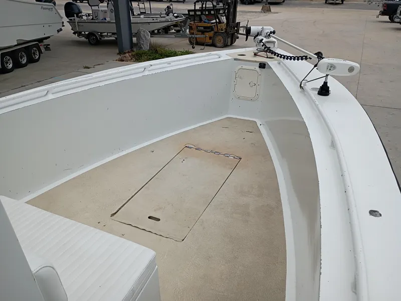 Slide: The Image of Open deck of a 2005 Custom 32CC boat, featuring a clean, spacious layout. - 13