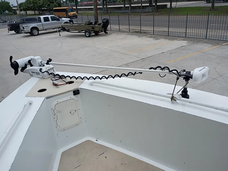 Slide: The Image of Custom 32CC boat with Minn Kota trolling motor, parked in a lot, 2005 model. - 18