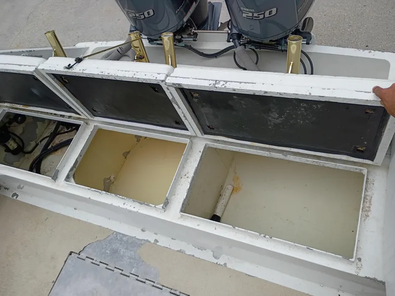 Slide: The Image of Open storage compartments on a 2005 Custom 32CC boat with Yamaha 250 engines. - 9