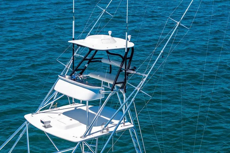 Slide: The Image of 2023 Hatteras GT45X boat tower against blue ocean water. - 10