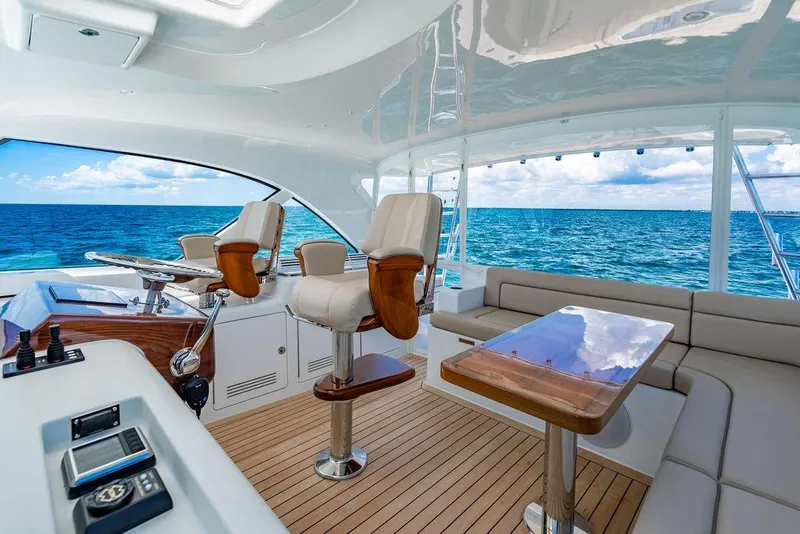 Slide: The Image of Luxurious interior of 2023 Hatteras GT45X yacht with ocean view and elegant seating. - 17