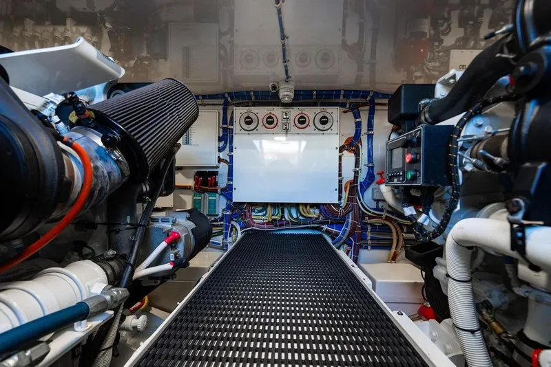 Slide: The Image of Engine room of 2023 Hatteras GT45X yacht, showcasing advanced machinery and wiring. - 30