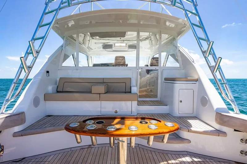 Slide: The Image of 2023 Hatteras GT45X yacht interior with seating and ocean view. - 7