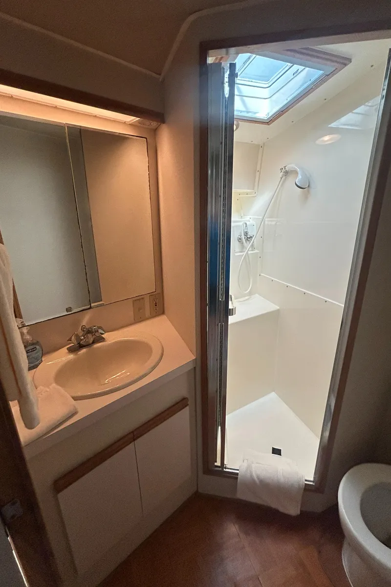 Slide: The Image of Bathroom interior of 1990 Bertram 50 Convertible yacht with shower and sink. - 33