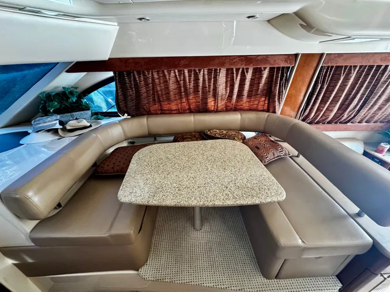 Slide: The Image of Luxurious interior of a 2007 Meridian 411 Sedan yacht with plush seating and elegant table. - 11