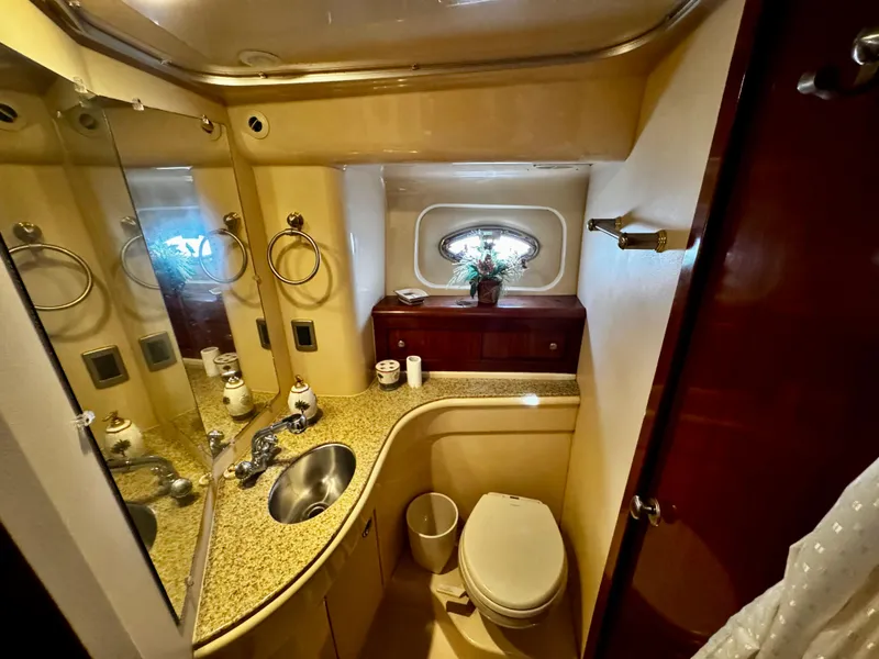 Slide: The Image of Luxurious bathroom in 2007 Meridian 411 Sedan yacht with granite countertop and elegant fixtures. - 16