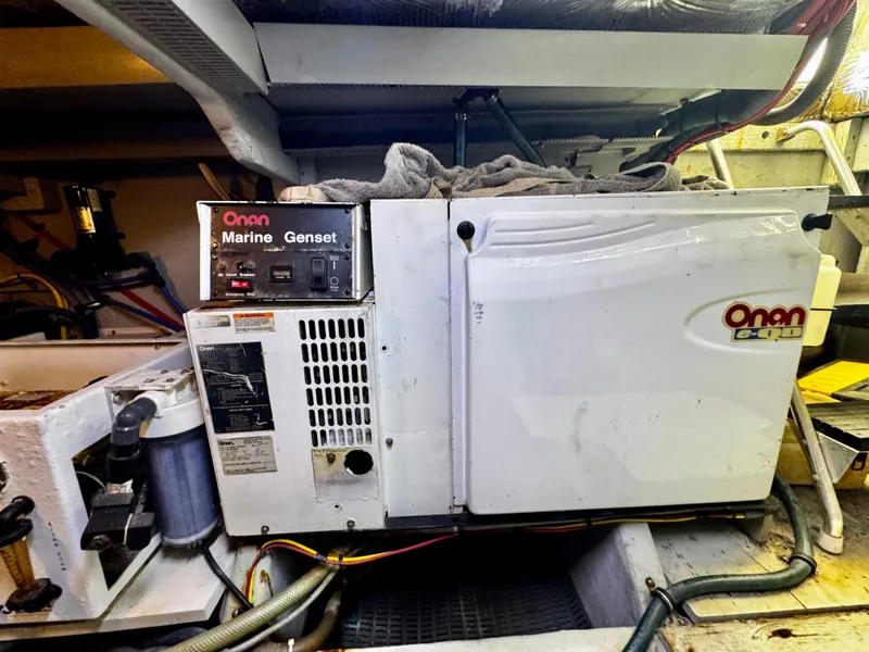 Slide: The Image of Onan marine generator in a 2007 Meridian 411 Sedan engine room. - 24