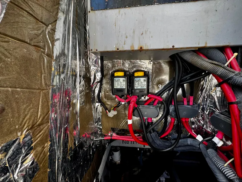 Slide: The Image of Electrical wiring and components inside a 2007 Meridian 411 Sedan boat. - 26