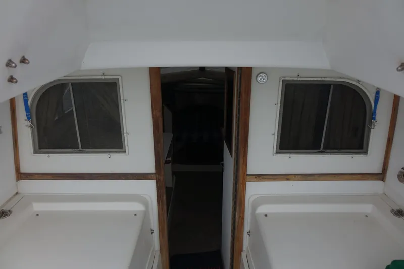Slide: The Image of 1988 Blackfin 29 Flybridge interior with dual windows and wooden trim. - 28