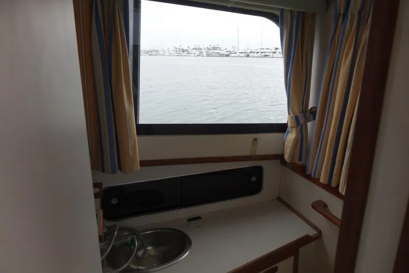 Slide: The Image of Interior view of 1988 Blackfin 29 Flybridge boat with sink and window. - 38