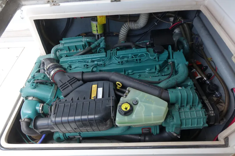 Slide: The Image of Engine compartment of a 1988 Blackfin 29 Flybridge boat, showcasing a well-maintained marine engine. - 42