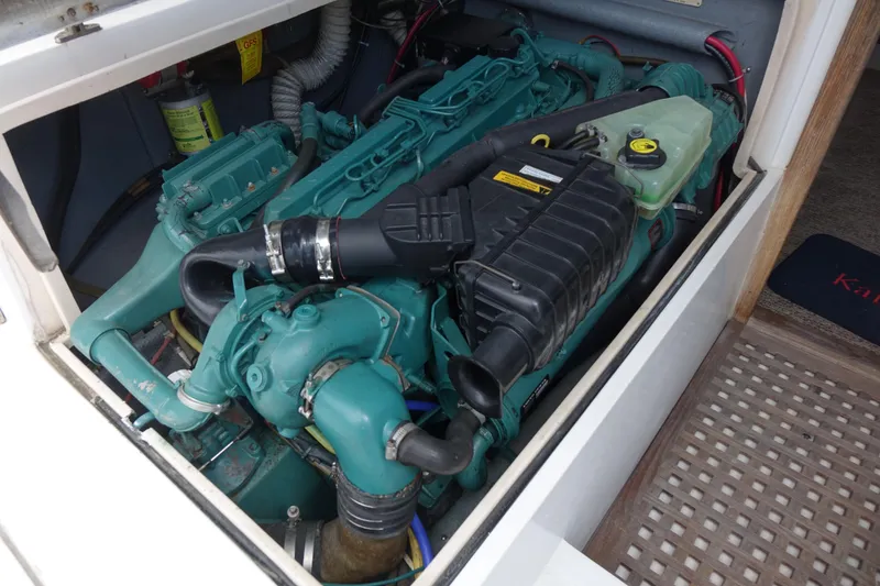Slide: The Image of Engine compartment of a 1988 Blackfin 29 Flybridge boat, showcasing detailed machinery. - 44