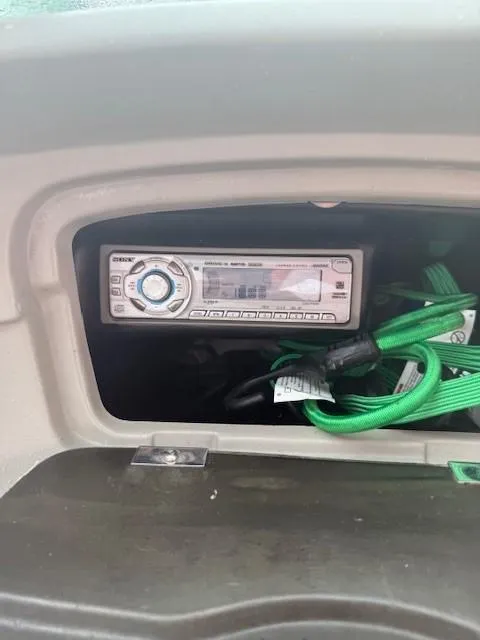 Slide: The Image of Boat dashboard with stereo system and green cables, Bryant 219, 2006 model. - 10