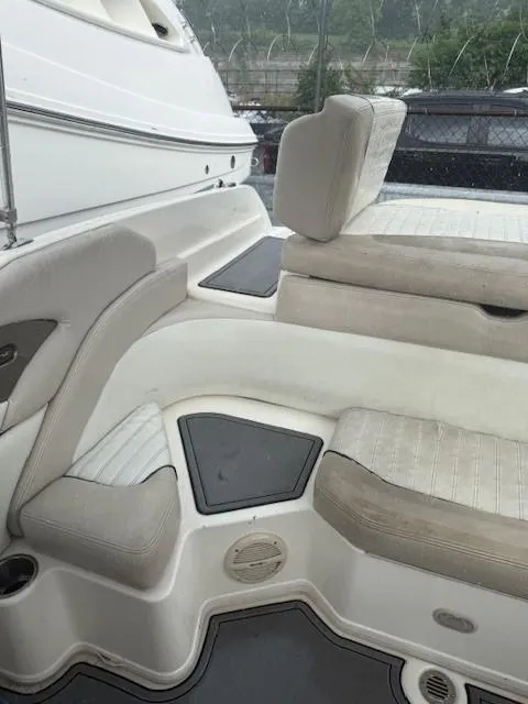 Slide: The Image of Interior seating of a 2006 Bryant 219 boat with beige upholstery. - 15