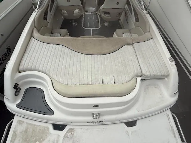 Slide: The Image of 2006 Bryant 219 boat interior with seating and deck view. - 19