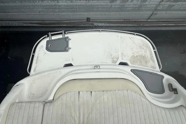 Slide: The Image of Rear view of a 2006 Bryant 219 boat with white seating and deck. - 20