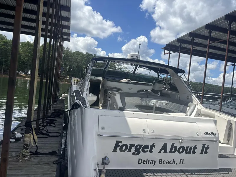 Slide: The Image of 1996 Sea Ray 500 Sundancer docked at Delray Beach, FL, under a clear sky. - 19
