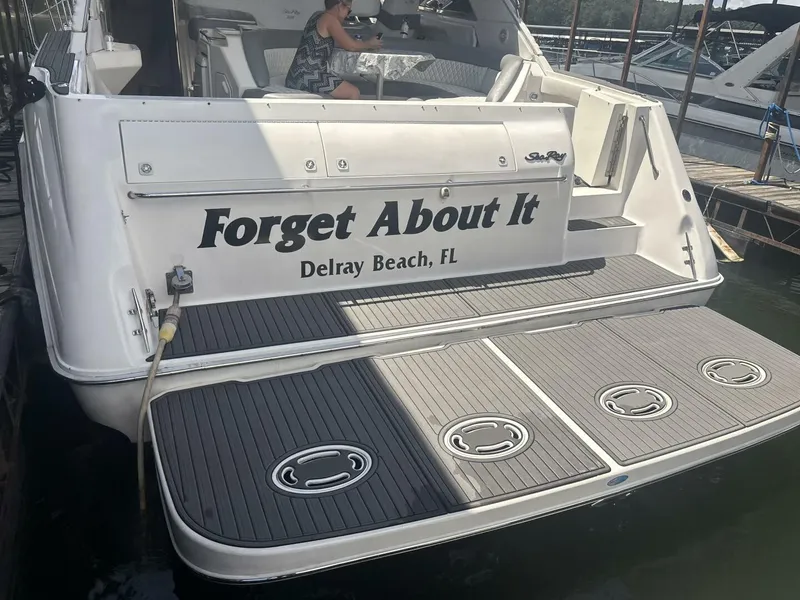 Slide: The Image of 1996 Sea Ray 500 Sundancer boat docked, named "Forget About It," Delray Beach, FL. - 21