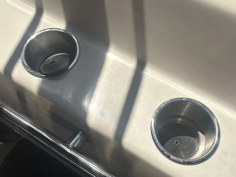 Slide: The Image of Cup holders on a 1996 Sea Ray 500 Sundancer boat, reflecting sunlight. - 33