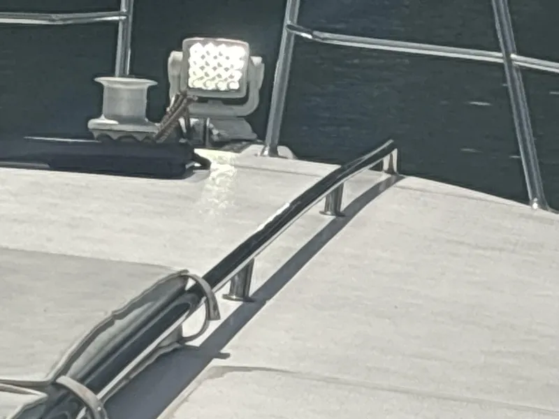 Slide: The Image of 1996 Sea Ray 500 Sundancer deck with railing and spotlight. - 41