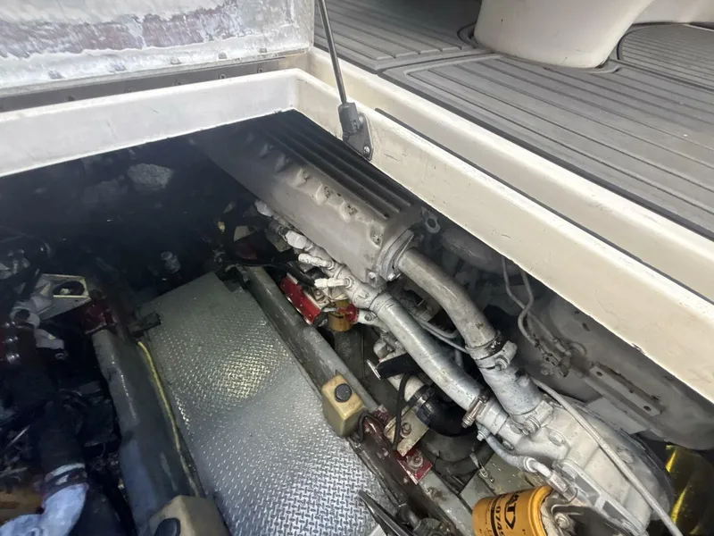 Slide: The Image of Engine compartment of a 1996 Sea Ray 500 Sundancer boat, showing mechanical components. - 42