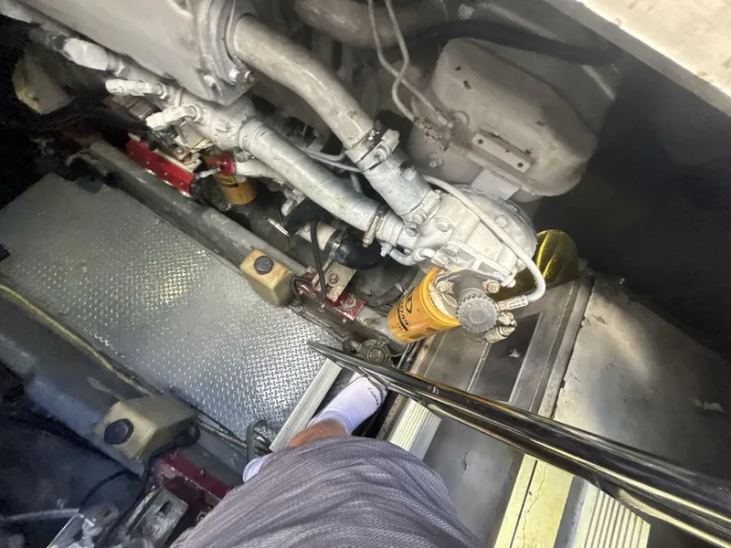 Slide: The Image of Engine room of a 1996 Sea Ray 500 Sundancer with visible mechanical components. - 43