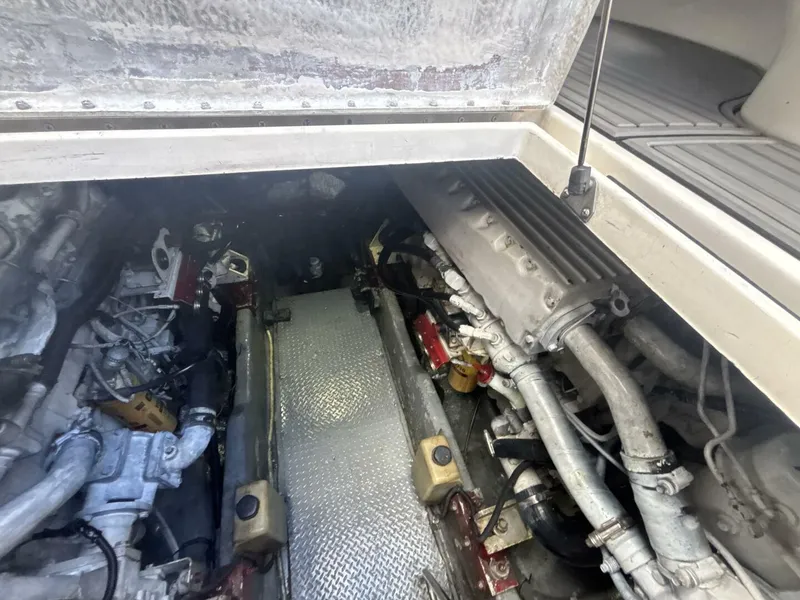 Slide: The Image of Engine compartment of a 1996 Sea Ray 500 Sundancer boat, showing mechanical components. - 44